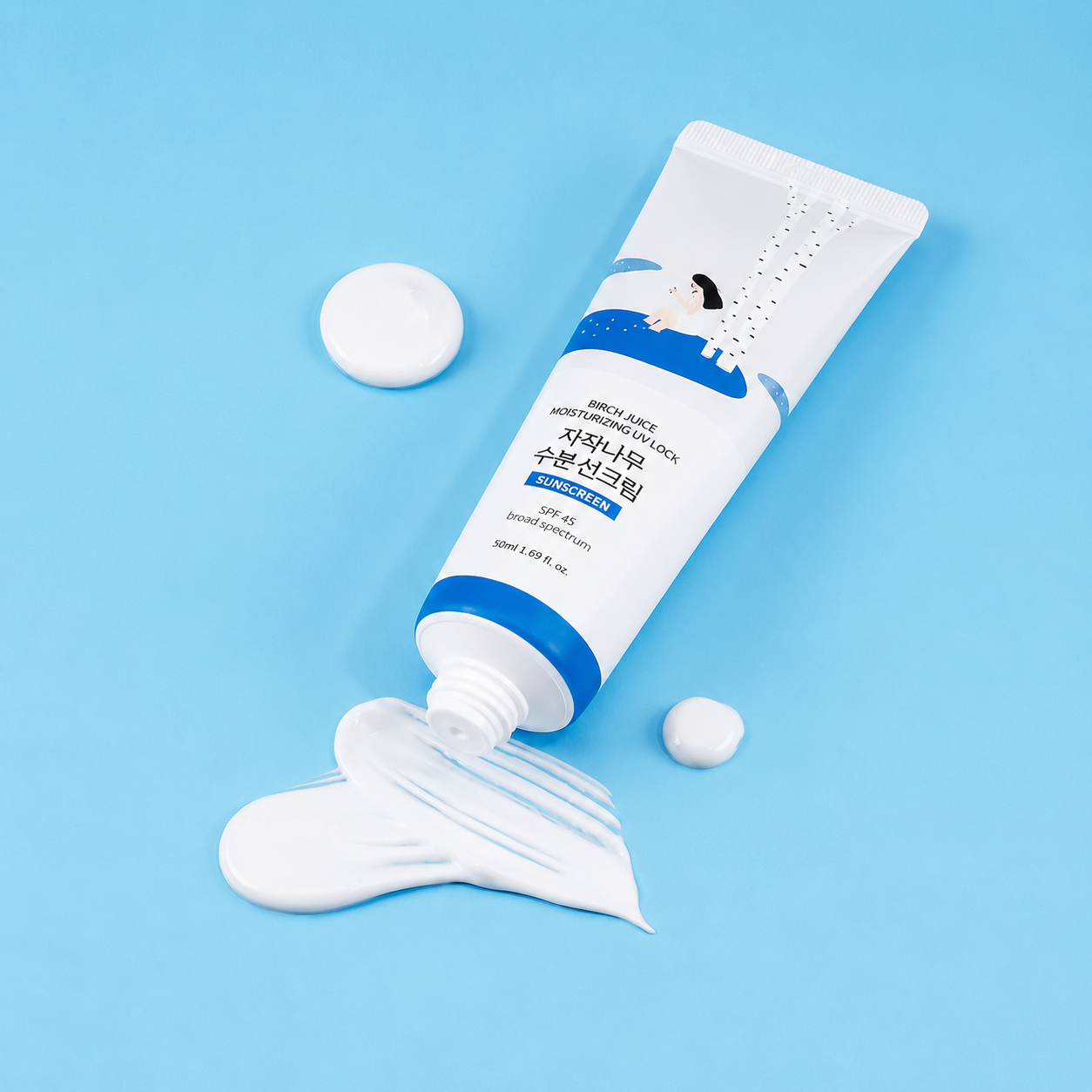 ROUND LAB Birch Juice Moisturizing UV Lock SPF 45 Korean sunscreen with creamy texture on blue background, lightweight hydration, no white cast, and daily UV protection